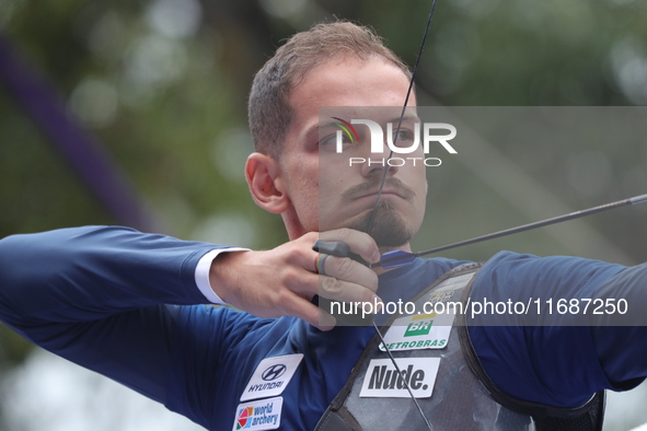 Marcus D'Almeida of Brazil competes against Andres Temino of Spain (not in picture) during the Men's recurve quarterfinals match on the fina...