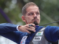 Marcus D'Almeida of Brazil competes against Andres Temino of Spain (not in picture) during the Men's recurve quarterfinals match on the fina...