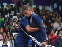 Marcus D'Almeida of Brazil competes against Andres Temino of Spain (not in picture) during the Men's recurve quarterfinals match on the fina...