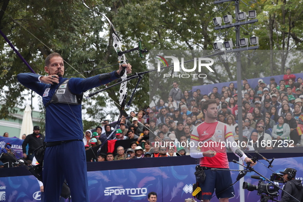 Marcus D'Almeida of Brazil and Andres Temino of Spain compete during the Men's recurve quarterfinals match on the final day of the Tlaxcala...