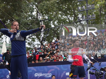 Marcus D'Almeida of Brazil and Andres Temino of Spain compete during the Men's recurve quarterfinals match on the final day of the Tlaxcala...