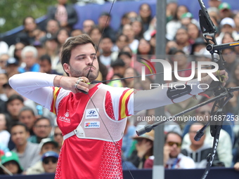 Andres Temino of Spain competes against Marcus D'Almeida of Brazil (not in picture) during the Men's recurve quarterfinals match on the fina...