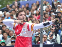 Andres Temino of Spain competes against Marcus D'Almeida of Brazil (not in picture) during the Men's recurve quarterfinals match on the fina...