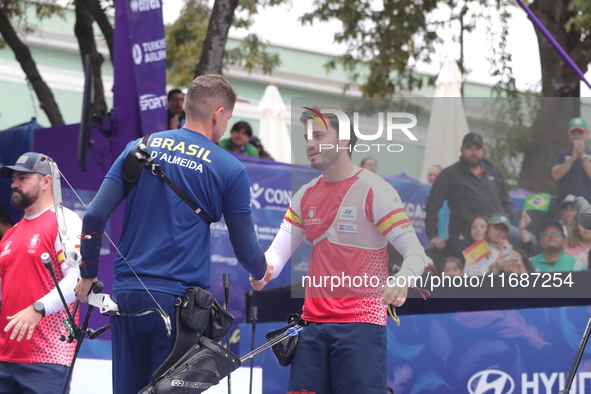 Marcus D'Almeida of Brazil and Andres Temino of Spain compete during the Men's recurve quarterfinals match on the final day of the Tlaxcala...