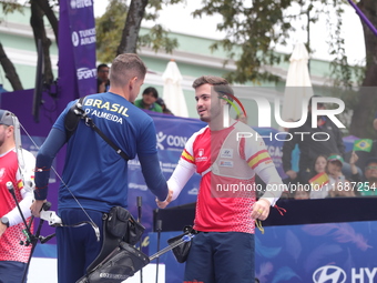 Marcus D'Almeida of Brazil and Andres Temino of Spain compete during the Men's recurve quarterfinals match on the final day of the Tlaxcala...