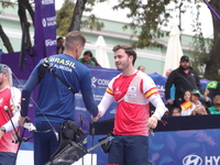 Marcus D'Almeida of Brazil and Andres Temino of Spain compete during the Men's recurve quarterfinals match on the final day of the Tlaxcala...