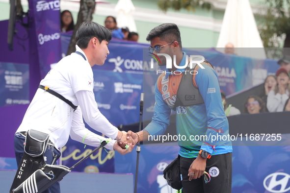 Woo-Seok Lee of Korea and Dhiraj Bommadevara of India compete during the Men's recurve quarterfinals match on the final day of the Tlaxcala...