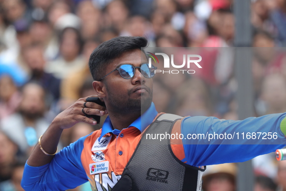 Dhiraj Bommadevara of India competes against Woo-Seok Lee of Korea (not in picture) during the Men's recurve quarterfinals match on the fina...