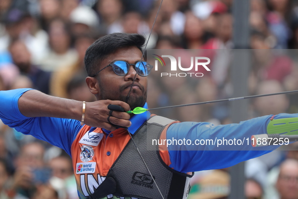 Dhiraj Bommadevara of India competes against Woo-Seok Lee of Korea (not in picture) during the Men's recurve quarterfinals match on the fina...