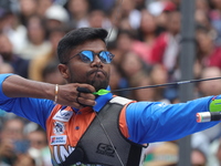 Dhiraj Bommadevara of India competes against Woo-Seok Lee of Korea (not in picture) during the Men's recurve quarterfinals match on the fina...