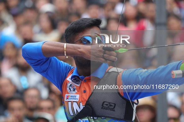 Dhiraj Bommadevara of India competes against Woo-Seok Lee of Korea (not in picture) during the Men's recurve quarterfinals match on the fina...