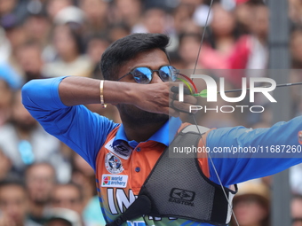 Dhiraj Bommadevara of India competes against Woo-Seok Lee of Korea (not in picture) during the Men's recurve quarterfinals match on the fina...