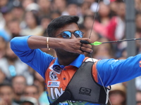 Dhiraj Bommadevara of India competes against Woo-Seok Lee of Korea (not in picture) during the Men's recurve quarterfinals match on the fina...