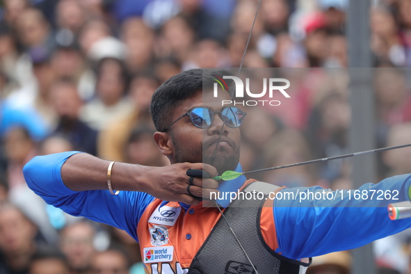 Dhiraj Bommadevara of India competes against Woo-Seok Lee of Korea (not in picture) during the Men's recurve quarterfinals match on the fina...