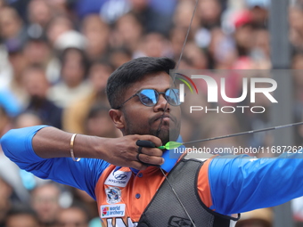 Dhiraj Bommadevara of India competes against Woo-Seok Lee of Korea (not in picture) during the Men's recurve quarterfinals match on the fina...