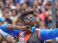 Dhiraj Bommadevara of India competes against Woo-Seok Lee of Korea (not in picture) during the Men's recurve quarterfinals match on the fina...