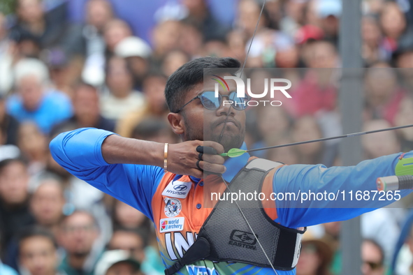 Dhiraj Bommadevara of India competes against Woo-Seok Lee of Korea (not in picture) during the Men's recurve quarterfinals match on the fina...