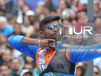 Dhiraj Bommadevara of India competes against Woo-Seok Lee of Korea (not in picture) during the Men's recurve quarterfinals match on the fina...