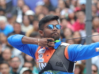 Dhiraj Bommadevara of India competes against Woo-Seok Lee of Korea (not in picture) during the Men's recurve quarterfinals match on the fina...