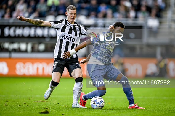 Heracles Almelo forward Suf Podgoreanu and AFC Ajax Amsterdam defender Jorrel Hato play during the match between Heracles Almelo and Ajax at...