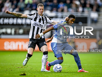 Heracles Almelo forward Suf Podgoreanu and AFC Ajax Amsterdam defender Jorrel Hato play during the match between Heracles Almelo and Ajax at...