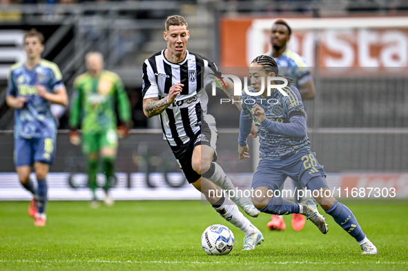 Heracles Almelo forward Suf Podgoreanu and AFC Ajax Amsterdam midfielder Kian Fitz-Jim play during the match between Heracles Almelo and Aja...