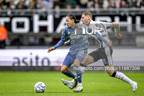 AFC Ajax Amsterdam midfielder Kian Fitz-Jim and Heracles Almelo forward Suf Podgoreanu play during the match between Heracles Almelo and Aja...