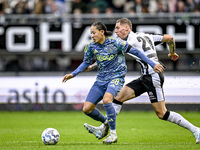 AFC Ajax Amsterdam midfielder Kian Fitz-Jim and Heracles Almelo forward Suf Podgoreanu play during the match between Heracles Almelo and Aja...