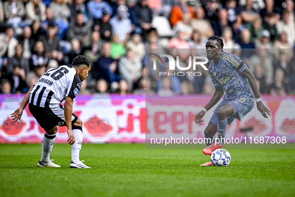 Heracles Almelo midfielder Daniel van Kaam and AFC Ajax Amsterdam forward Bertrand Traore play during the match between Heracles Almelo and...