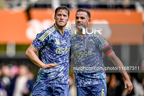 AFC Ajax Amsterdam forward Wout Weghorst and AFC Ajax Amsterdam midfielder Jordan Henderson celebrate the 2-3 goal during the match between...