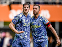 AFC Ajax Amsterdam forward Wout Weghorst and AFC Ajax Amsterdam midfielder Jordan Henderson celebrate the 2-3 goal during the match between...