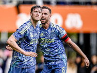 AFC Ajax Amsterdam forward Wout Weghorst and AFC Ajax Amsterdam midfielder Jordan Henderson celebrate the 2-3 goal during the match between...