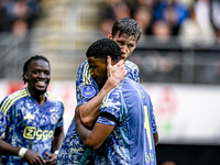 AFC Ajax Amsterdam forward Wout Weghorst and AFC Ajax Amsterdam defender Jorrel Hato celebrate the 2-3 goal during the match between Heracle...