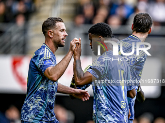 AFC Ajax Amsterdam midfielder Jordan Henderson and AFC Ajax Amsterdam defender Jorrel Hato celebrate the 2-3 goal during the match between H...