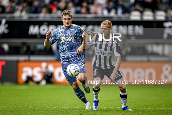 AFC Ajax Amsterdam forward Christian Rasmussen and Heracles Almelo defender Jannes Wieckhof play during the match Heracles Almelo vs. Ajax a...