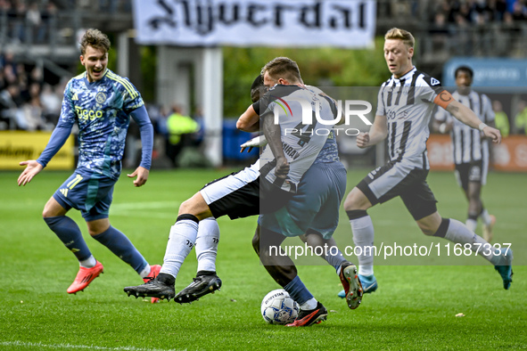 Heracles Almelo defender Damon Mirani and AFC Ajax Amsterdam forward Brian Brobbey participate in the match between Heracles Almelo and Ajax...