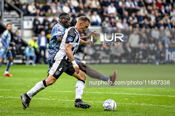 AFC Ajax Amsterdam forward Brian Brobbey and Heracles Almelo defender Damon Mirani play during the match between Heracles Almelo and Ajax at...