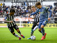 Heracles Almelo defender Mimeirhel Benita, Heracles Almelo midfielder Brian de Keersmaecker, and AFC Ajax Amsterdam forward Mika Godts parti...