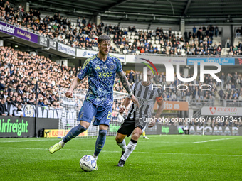 AFC Ajax Amsterdam forward Wout Weghorst and AFC Ajax Amsterdam defender Jorrel Hato participate in the match between Heracles Almelo and Aj...