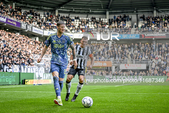 AFC Ajax Amsterdam forward Wout Weghorst and AFC Ajax Amsterdam defender Jorrel Hato participate in the match between Heracles Almelo and Aj...