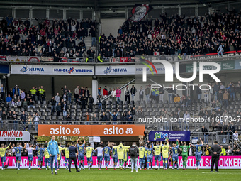 AFC Ajax players celebrate the win with the supporters during the match between Heracles Almelo and Ajax at the Asito Stadium for the Dutch...