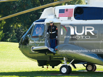 US President Joe Biden walks to the Oval Office after landing on the South Lawn of the White House in Washington, DC, on October 20, 2024, a...