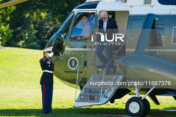 US President Joe Biden walks to the Oval Office after landing on the South Lawn of the White House in Washington, DC, on October 20, 2024, a...