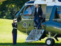 US President Joe Biden walks to the Oval Office after landing on the South Lawn of the White House in Washington, DC, on October 20, 2024, a...