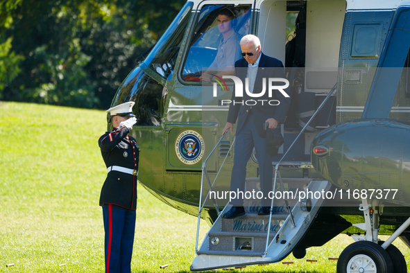 US President Joe Biden walks to the Oval Office after landing on the South Lawn of the White House in Washington, DC, on October 20, 2024, a...