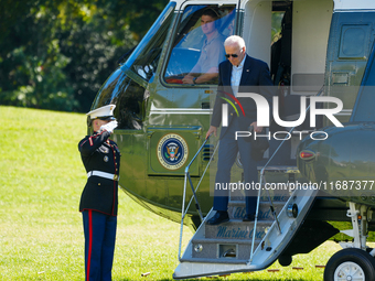 US President Joe Biden walks to the Oval Office after landing on the South Lawn of the White House in Washington, DC, on October 20, 2024, a...