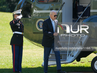 US President Joe Biden walks to the Oval Office after landing on the South Lawn of the White House in Washington, DC, on October 20, 2024, a...