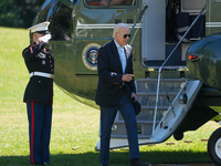 US President Joe Biden walks to the Oval Office after landing on the South Lawn of the White House in Washington, DC, on October 20, 2024, a...