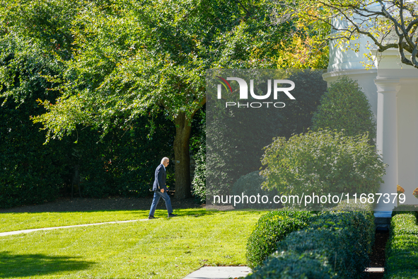 US President Joe Biden walks to the Oval Office after landing on the South Lawn of the White House in Washington, DC, on October 20, 2024, a...