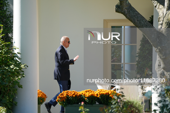 US President Joe Biden walks to the Oval Office after landing on the South Lawn of the White House in Washington, DC, on October 20, 2024, a...